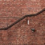 Photo industrial pipe style wall sconce